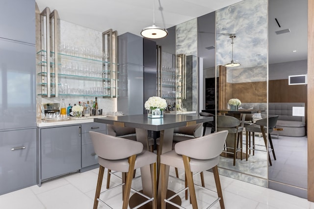 interior space with tile walls and bar area