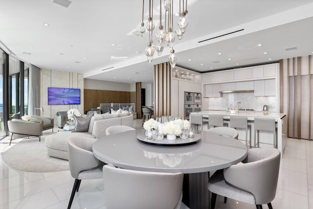 dining area featuring light tile patterned floors