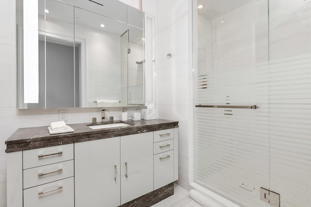 bathroom featuring vanity and walk in shower