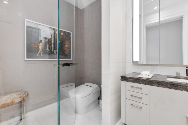 bathroom featuring vanity, toilet, tile patterned floors, and walk in shower