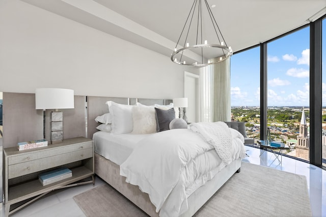 bedroom with light tile patterned flooring, multiple windows, an inviting chandelier, and floor to ceiling windows