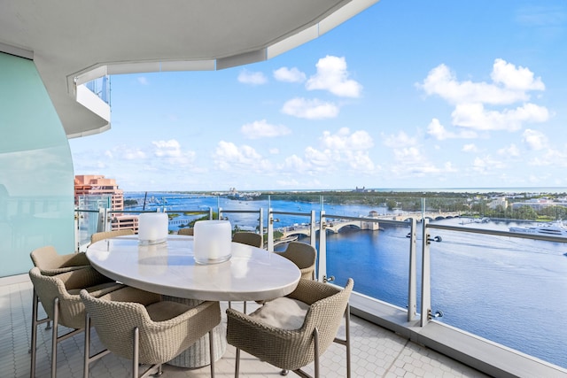 balcony featuring a water view