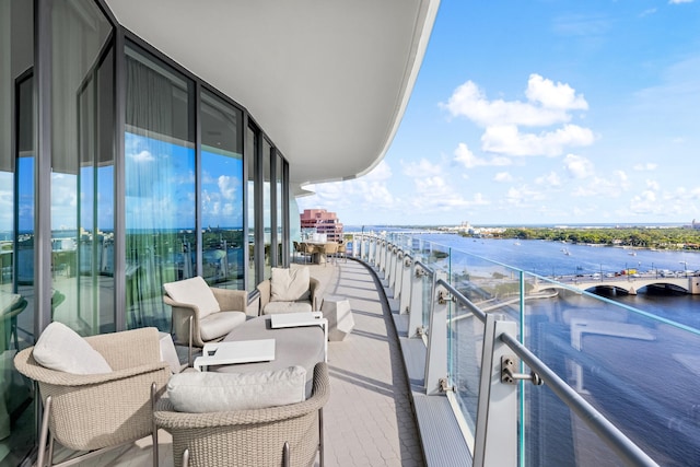 balcony featuring a water view