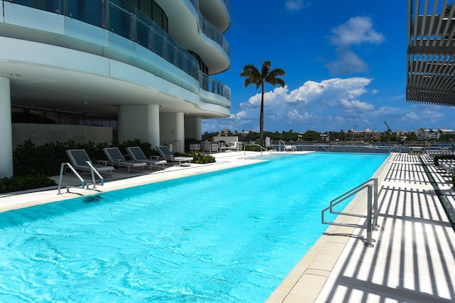 view of swimming pool with a patio