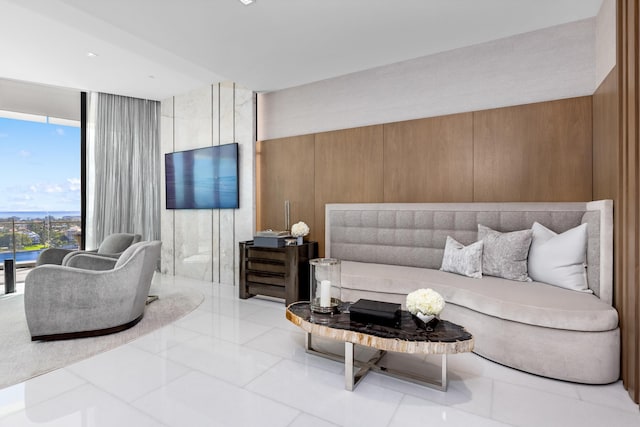 tiled living room with floor to ceiling windows