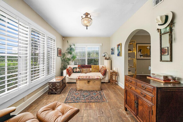 323 Dyer Rd, West Palm Beach, FL 33405 - living room with wood finished floors, arched walkways, and baseboards