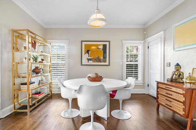 323 Dyer Rd, West Palm Beach, FL 33405 - dining space featuring hardwood / wood-style flooring, crown molding, and baseboards