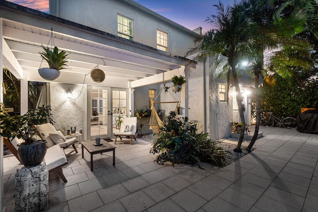 patio terrace at dusk with french doors