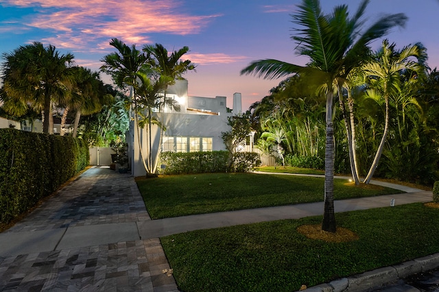 view of front of home with a yard