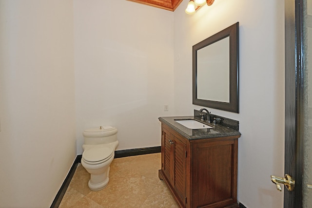 bathroom with vanity, toilet, and tile patterned flooring