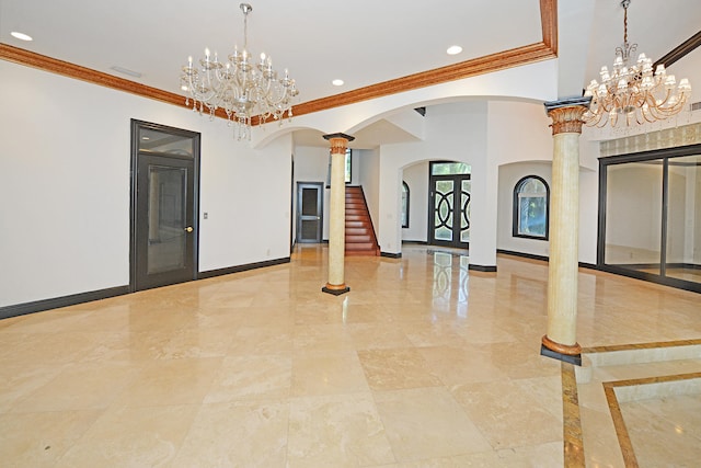 interior space with crown molding and ornate columns