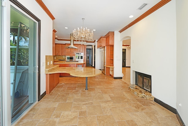 kitchen featuring tasteful backsplash, appliances with stainless steel finishes, island range hood, ornamental molding, and decorative light fixtures