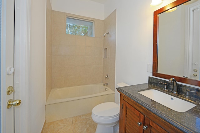 full bathroom with tiled shower / bath, vanity, toilet, and tile patterned flooring