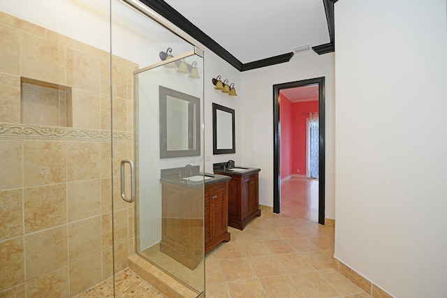 bathroom featuring vanity, crown molding, tile patterned flooring, and an enclosed shower