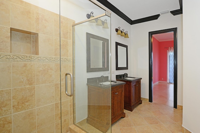 bathroom featuring vanity, ornamental molding, walk in shower, and tile patterned floors