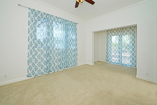 unfurnished room with light carpet, ornamental molding, and ceiling fan