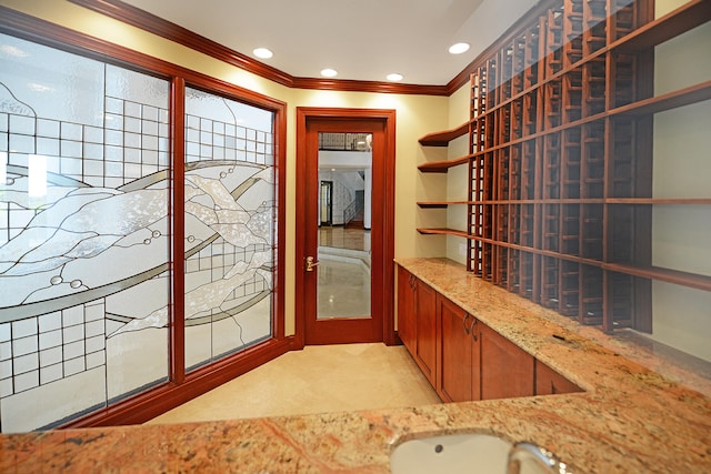 wine room with crown molding