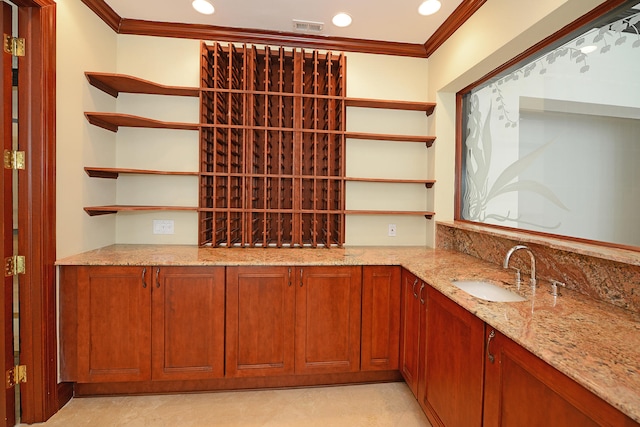 wine cellar featuring crown molding and sink