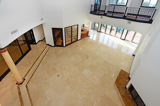 living room featuring a high ceiling