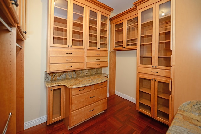 walk in closet featuring dark parquet flooring