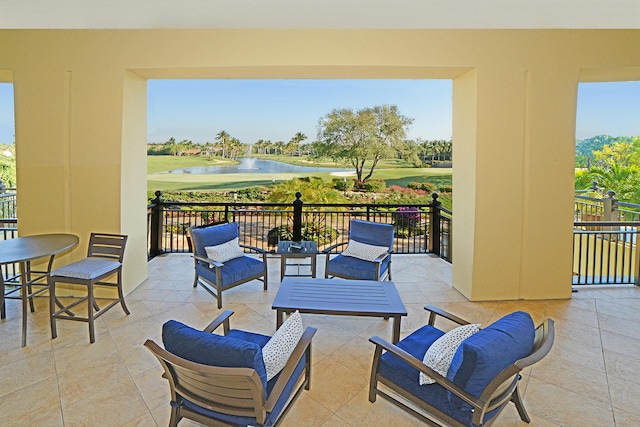 view of patio / terrace featuring outdoor lounge area and a water view