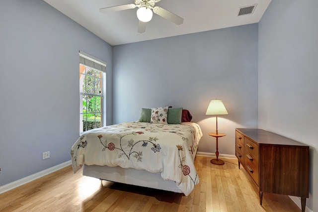 bedroom featuring light hardwood / wood-style flooring and ceiling fan