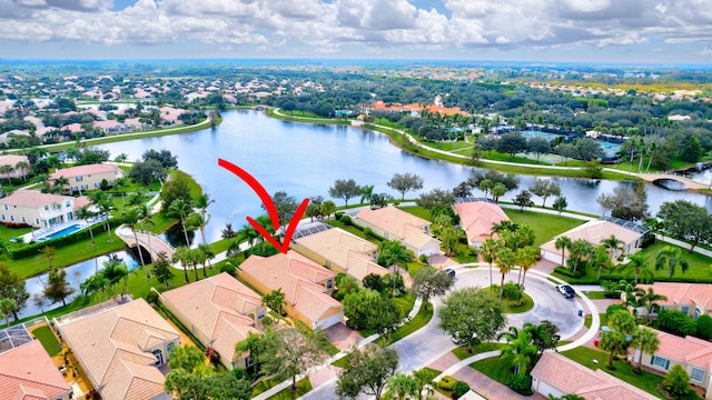 birds eye view of property with a water view