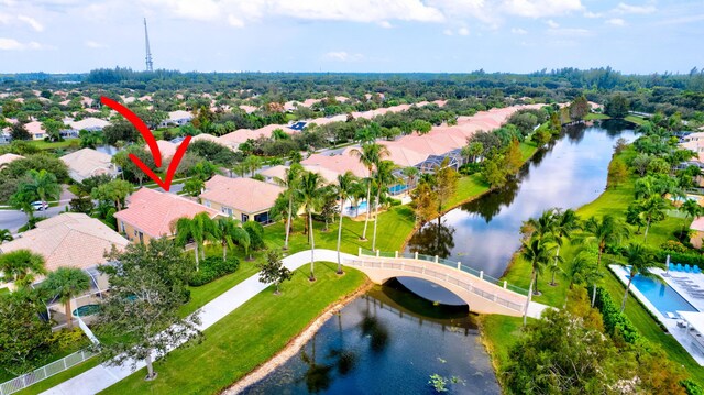 birds eye view of property featuring a residential view and a water view