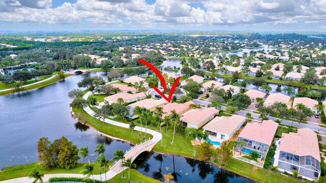 bird's eye view featuring a water view and a residential view