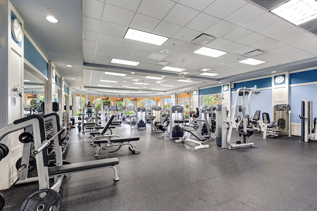 workout area featuring a paneled ceiling