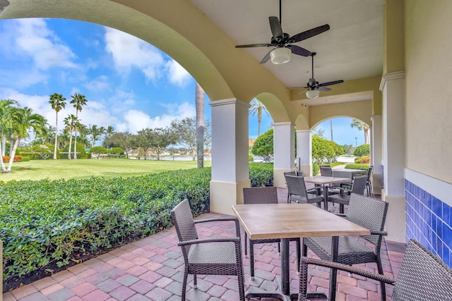 view of patio featuring ceiling fan