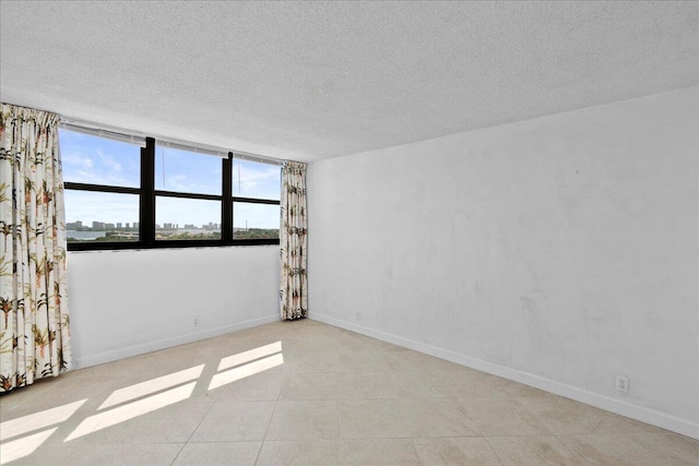 spare room featuring a textured ceiling