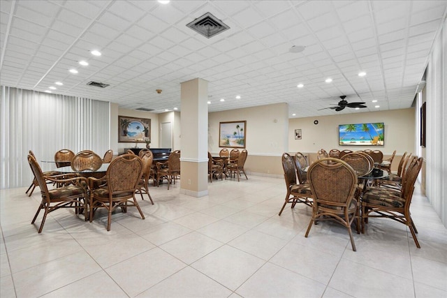 tiled dining room featuring ceiling fan