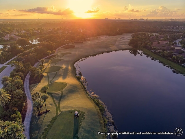 aerial view at dusk with a water view