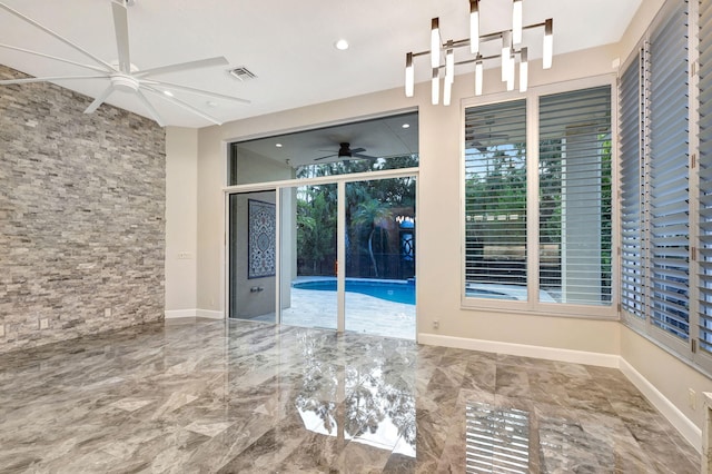 unfurnished room featuring ceiling fan