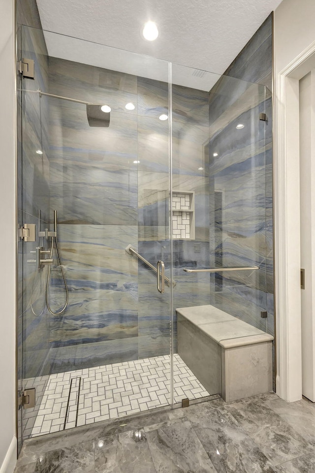 bathroom featuring an enclosed shower