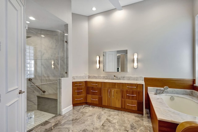 bathroom with vanity and independent shower and bath