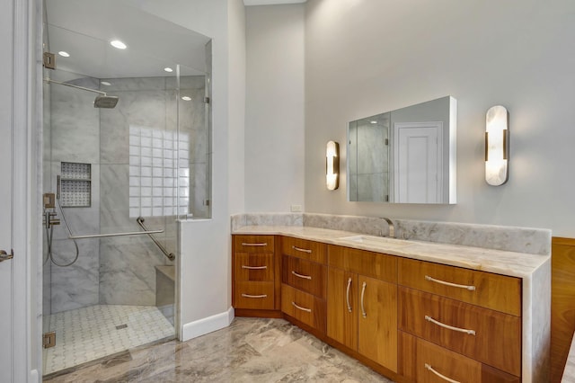 bathroom featuring vanity and an enclosed shower