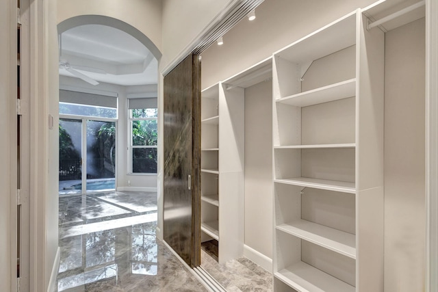 spacious closet with ceiling fan