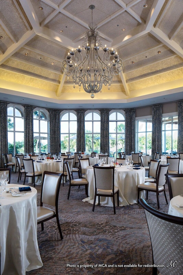 dining area with a notable chandelier, beam ceiling, and coffered ceiling