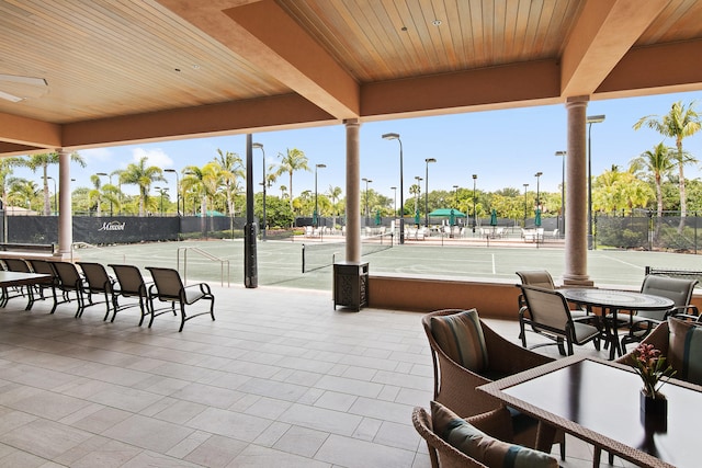 view of patio / terrace featuring tennis court