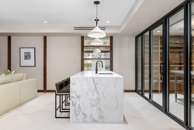 bar featuring sink and pendant lighting