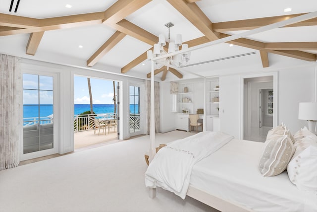 carpeted bedroom featuring a notable chandelier, access to exterior, lofted ceiling with beams, and a water view