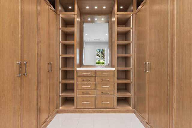 walk in closet featuring light tile patterned floors