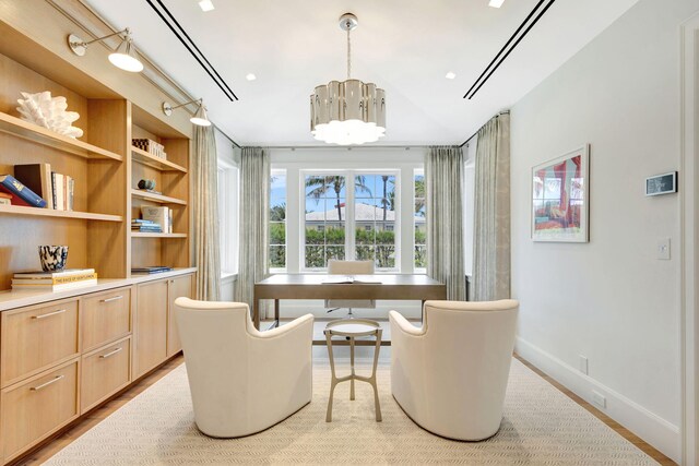 office featuring a chandelier and baseboards
