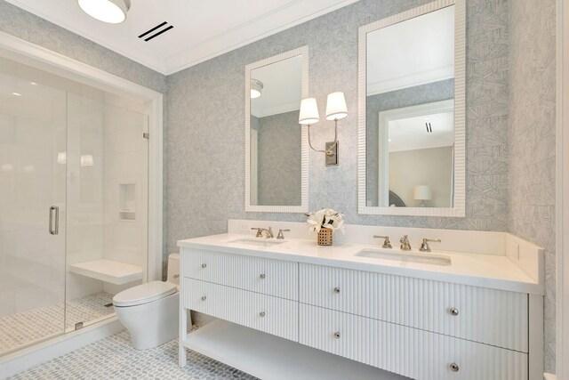 full bath with toilet, a shower stall, tile patterned flooring, ornamental molding, and double vanity