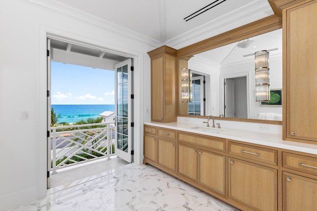 bathroom with vanity, crown molding, and a water view