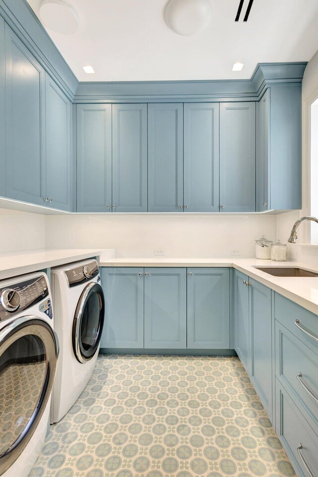 washroom with cabinet space and independent washer and dryer