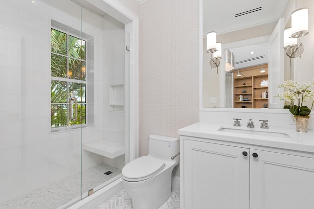 bathroom with vanity, a shower, crown molding, and toilet