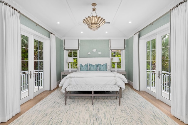 bedroom featuring french doors, multiple windows, and access to outside